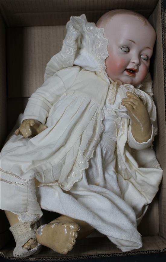 A Kestner character baby, body overpainted, vintage clothes, 22in.